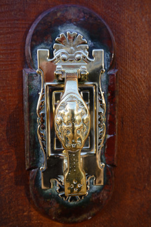 European Vintage old metal wrought iron door knocker. Design detail. Paris.の写真素材
