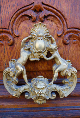 European Vintage old metal wrought iron door knocker. Design detail. Paris.の写真素材