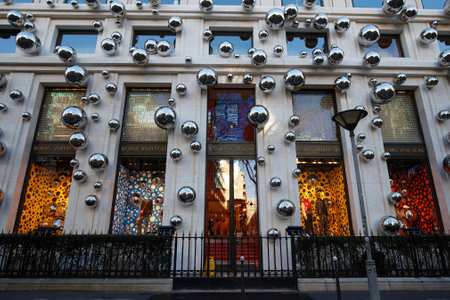 Luxury Boutique of Louis Vuitton at Montaigne avenue in Paris, France. View of wonderful showcase.のeditorial素材