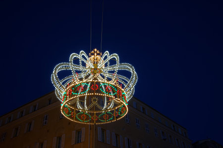 A neon light imperial crown in honor of French Emperor Napoleon I suspended in the air above Ajaccio , Franceのeditorial素材