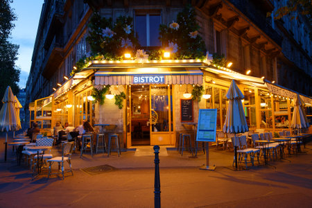 Typical Parisian cafe Marguerite at night located next town hall of Paris, France.のeditorial素材