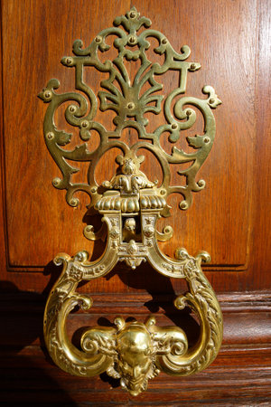 European Vintage old metal wrought iron door knocker. Design detail. Paris.の写真素材