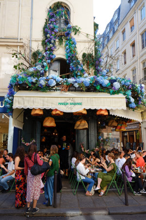 The traditional French cafe Maison sauvage decorated with flowers . It located in Saint German district in Paris .のeditorial素材