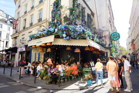 The traditional French cafe Maison sauvage decorated with flowers . It located in Saint German district in Paris .のeditorial素材
