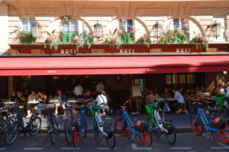 The traditional French cafe Buci decorated with flowers It located in Saint German district in Paris.のeditorial素材