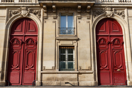 Old ornate doors in Paris, France - typical old apartment building.の写真素材