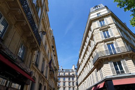 Paris, typical facades and windows, beautiful buildings, with old zinc roofsの写真素材