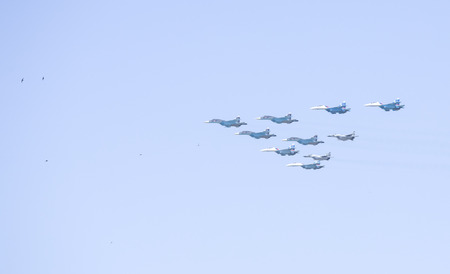 Ceremonial flight aviation in the sky over Moscow. A group of military aircraft in the air