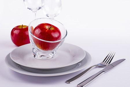 Apples on table laid for celebrationの写真素材