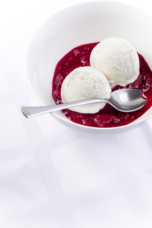 Vanilla ice cream scoops with raspberry sauce Heisse Liebe austrian dessert の写真素材