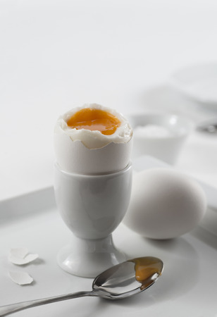 White soft-boiled eggs for breakfast one openedの写真素材