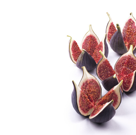 Cut figs on white background isolatedの写真素材