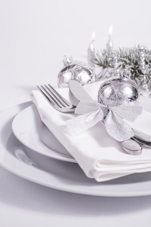Silver table set with candles for New Yearの写真素材