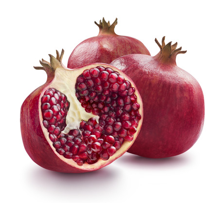 Two whole and one half of pomegranate isolatedの写真素材