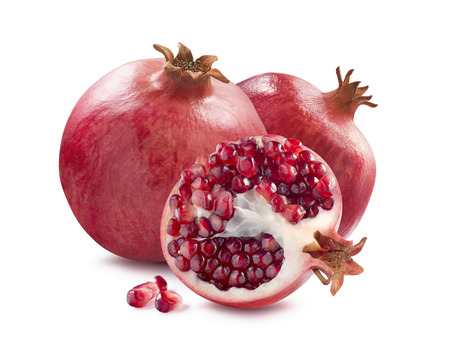 Two whole pomegranate and half slice isolated on white background as package design elementsの写真素材