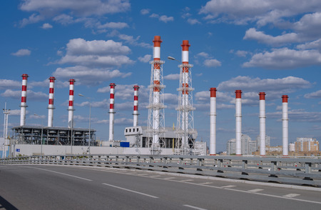 Fuel and power energy station over road at blue sky backgroundの写真素材