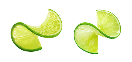 Fresh lIme slice twist isolated on white background as package design elementの写真素材