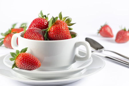 Fresh strawberry in white soup bowl for menu and invitation isolatedの写真素材