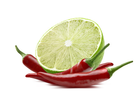 Lime cut and chili isolated on white background as package design elementの写真素材
