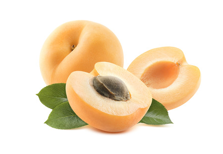 Whole apricot two halves leaves isolated on white background as package design elementの写真素材