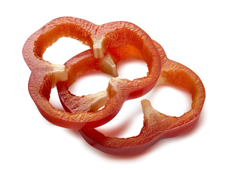 Red sweet pepper separate sliced pieces isolated on white backgroundの写真素材