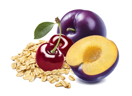 Red cherry, plums and oats isolated on white background.の写真素材