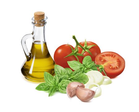 Italian pesto ingredients, tomato, green basil, garlic, onion  and olive oil in bottle isolated on whiteの写真素材
