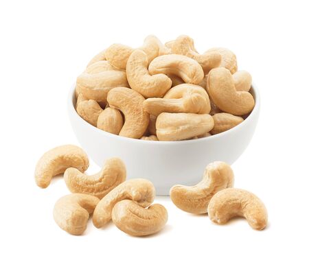 Bowl with cashew nuts isolated on whiteの写真素材