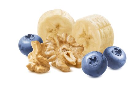 Sliced bananas, blueberry and walnuts isolated on whiteの写真素材