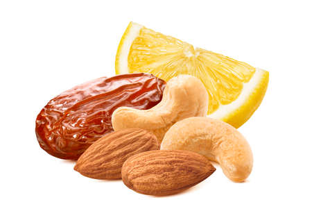 Slice of lemon, date, cashew and almond nuts isolated on white background.の写真素材
