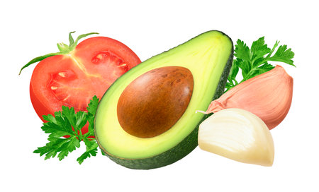 Avocado, tomato, garlic and parsley isolated on whiteの写真素材