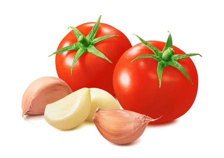 Tomato and garlic cloves isolated on whiteの写真素材