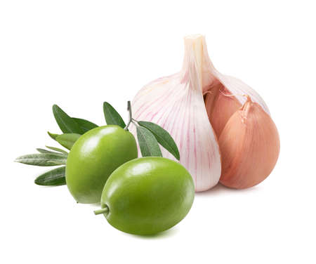 Garlic cloves and green olives isolated on whiteの写真素材