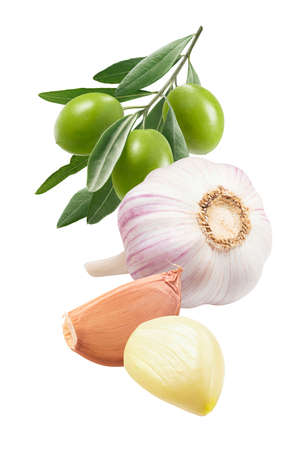 Green olives, garlic bulb and cloves isolated on whiteの写真素材