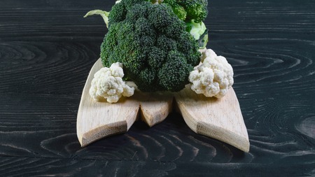 View of organic broccoli and cauliflower on wooden case. Authentic lifestyle image. Seasonal harvest crop local produce concept.の写真素材