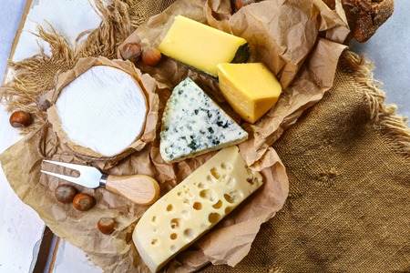 cheese board, cheese with blue mildew, Camembert or brie cheese circle, Cheese Serving Knife. top view, copy space.の写真素材