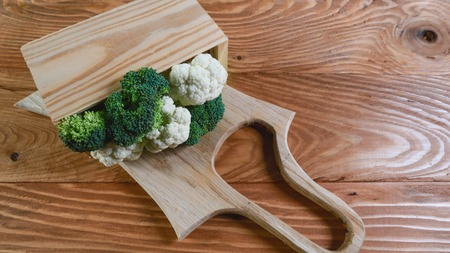Fresh green broccoli in a wooden box, rustic background - healthy or vegetarian food concept Top view, place for textの写真素材