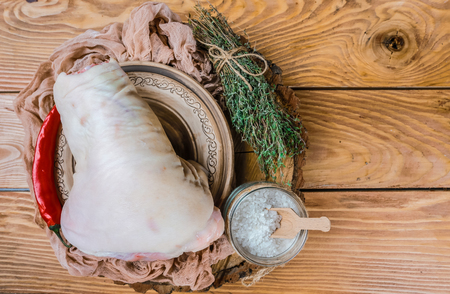 Raw pork knuckle. Ready for cooking. Authentic lifestyle image. Oktovber recipe for festival. concept of Bavarian cooking recipe.の写真素材