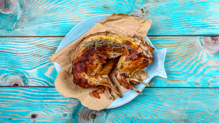 Roasted rabbit with sour cream sauce with lemon. A festive meal. gourmet food. Top view.の写真素材
