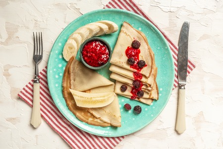 French style crepes with banana, Berries. Top view. Flat lay. space for textの写真素材