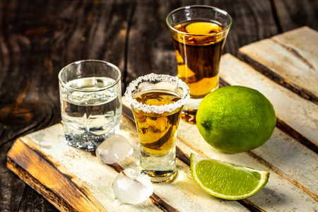 Different alcoholic drink in glass on rustic wood background. space for text. concept luxury drink.の写真素材