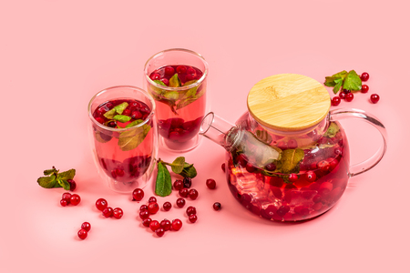 Detox Infused Water with Cranberries and Mint, living coral background. space for text.の写真素材