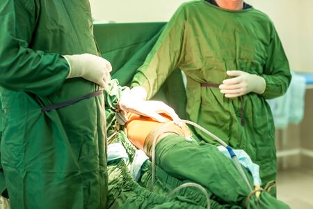total hip arthroplasty with cement fixation of components. Hospital background.