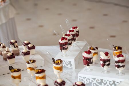Dessert table for a party. Candy bar. Table with sweets, candies, dessert.