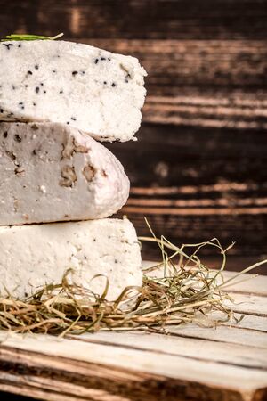 various types of cheese on rustic wooden table. Delicious cheese on the table.の写真素材