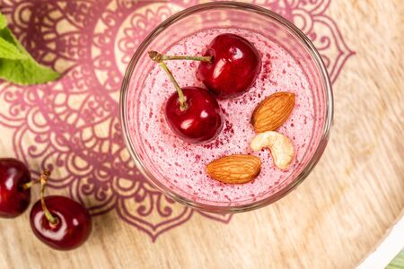 Dessert panna cotta in glass with fresh cherry. Food recipe background.の写真素材