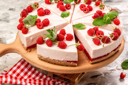 no baked raspberry cheesecake with fresh berries and mint for dessert. healthy organic summer dessert pie cheesecake. Cheese cake.の写真素材