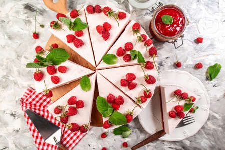Cheese cake with fresh berries on wooden table. raspberry cream mousse cake no baked top view.の写真素材