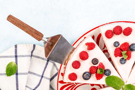 Summer raspberry and blueberry no bake cheesecake, banner menu recipe place for text, top view.の写真素材