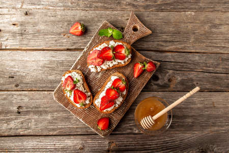 Strawberry bruschetta with goat cheese,basil and balsamic vinegarの写真素材